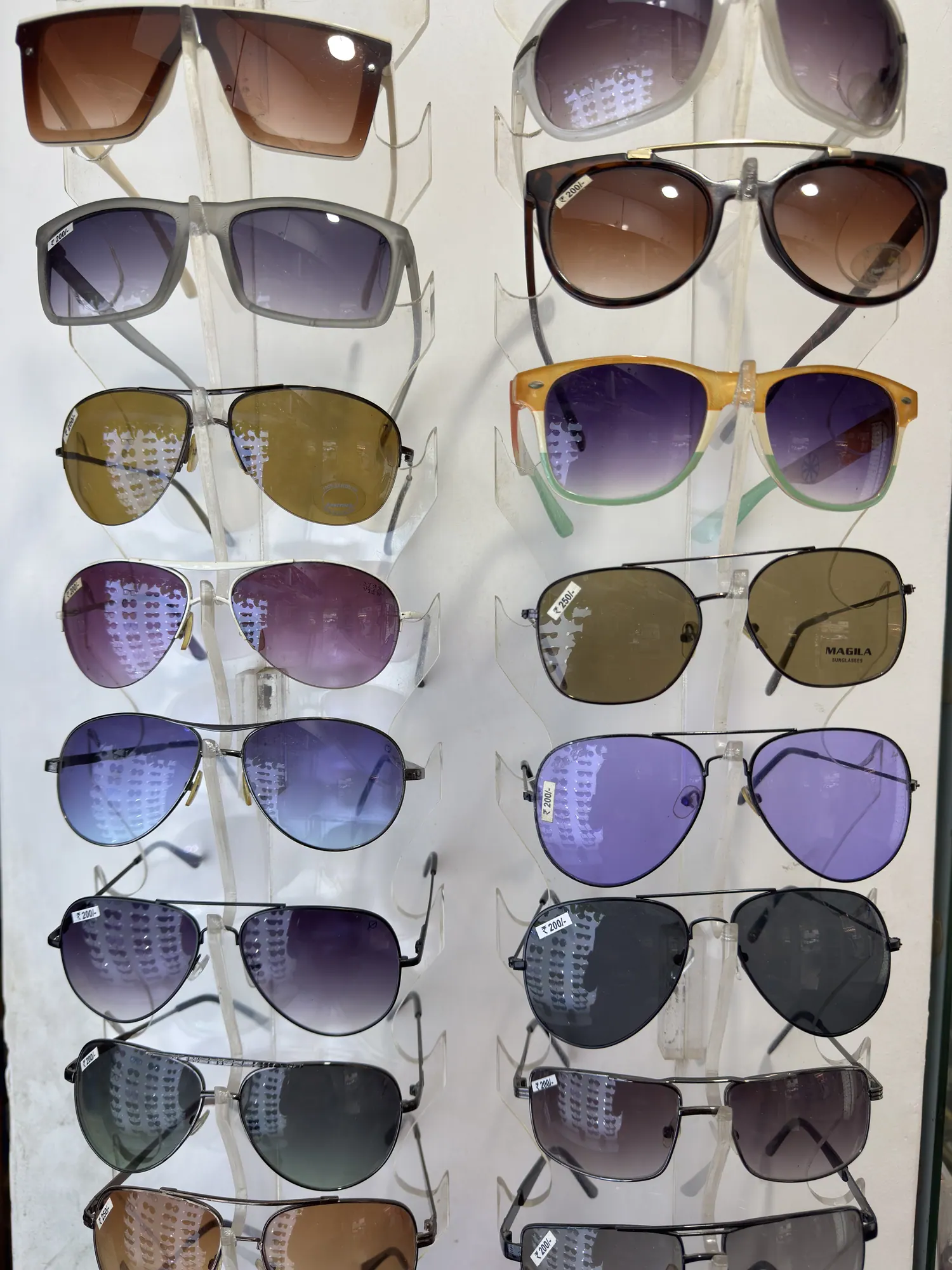 Aviator and rectangular sunglasses on display at Ami Optics